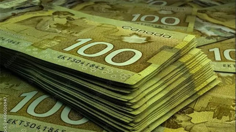 الدولار الكندي ينخفض إلى أدنى مستوياته في أكثر من 4 سنوات